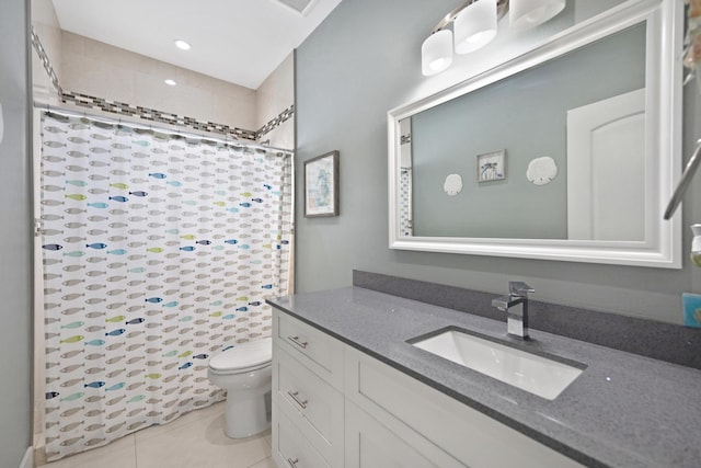 bathroom featuring curtained shower, vanity, toilet, and tile patterned floors