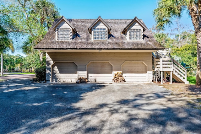 view of side of home with a garage