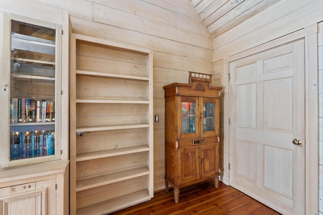 room details featuring wood finished floors and wooden walls