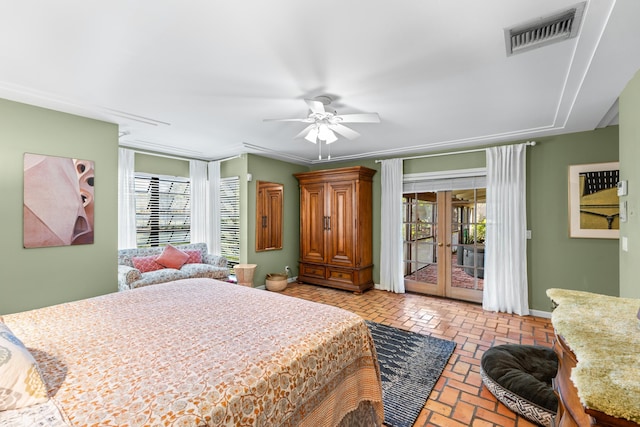 bedroom with access to exterior, brick floor, visible vents, and multiple windows