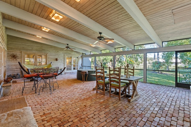 sunroom / solarium featuring lofted ceiling with beams and ceiling fan