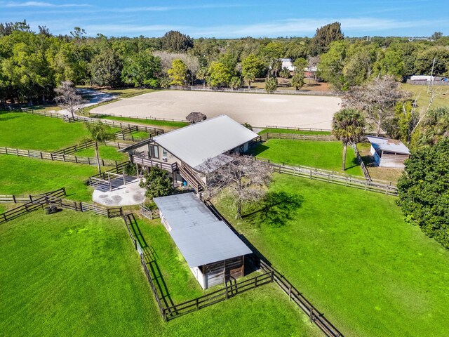 birds eye view of property with a rural view