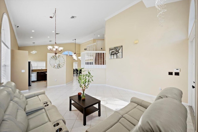 living room with light tile patterned floors, baseboards, ornamental molding, an inviting chandelier, and recessed lighting