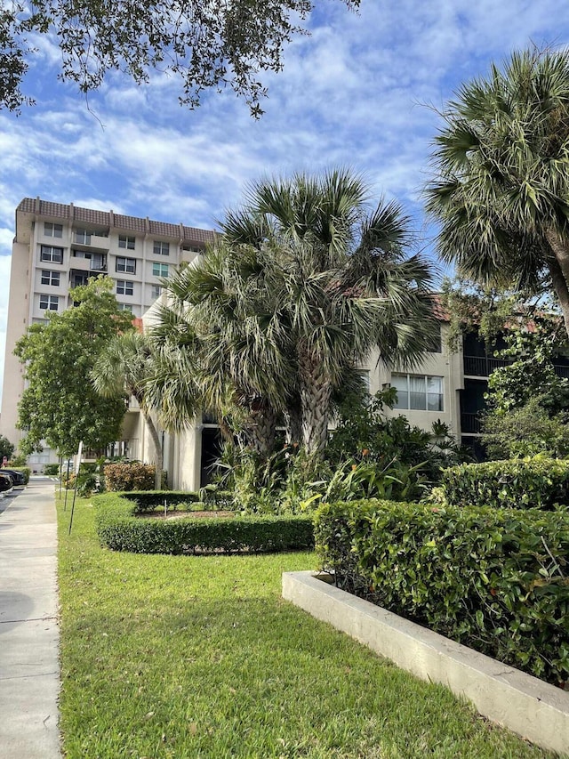 view of community featuring a yard