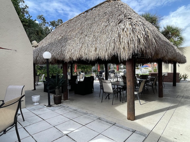 view of community with a patio area and a gazebo