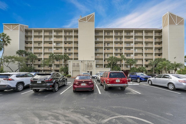 view of property with uncovered parking