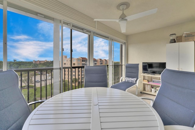 sunroom with a ceiling fan