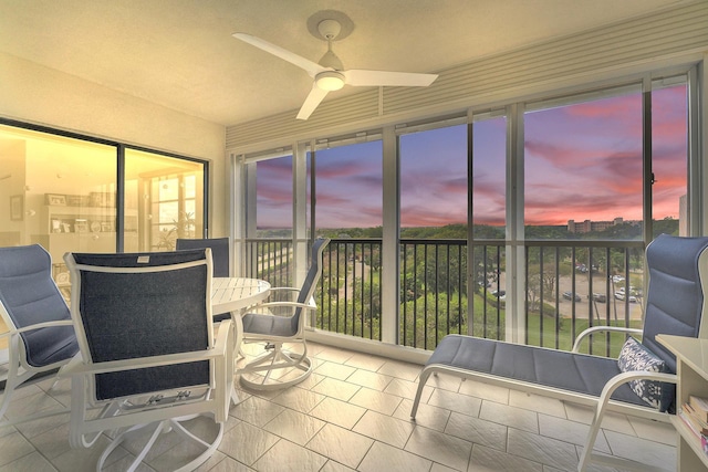 sunroom with a ceiling fan