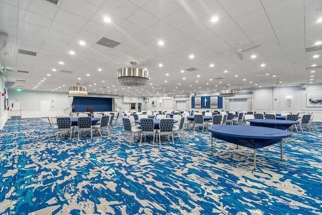 carpeted dining room with visible vents