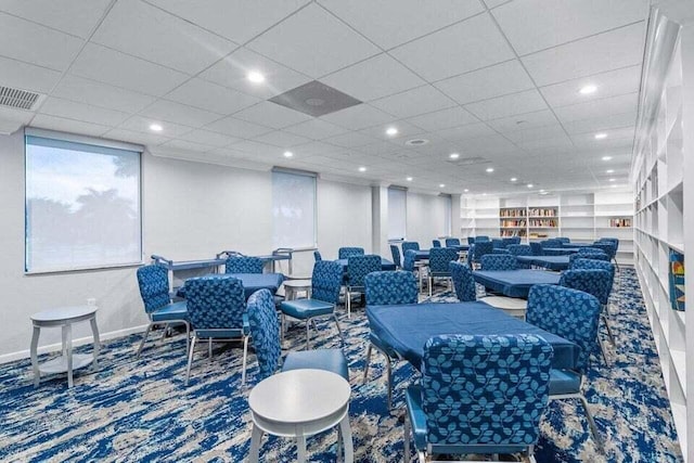 dining space featuring built in shelves, recessed lighting, visible vents, and baseboards