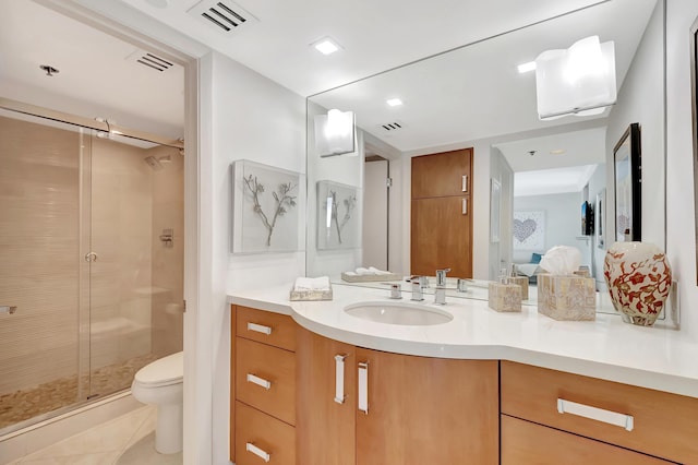 full bath with visible vents, toilet, a stall shower, ensuite bath, and vanity