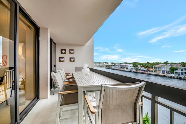 balcony featuring a water view