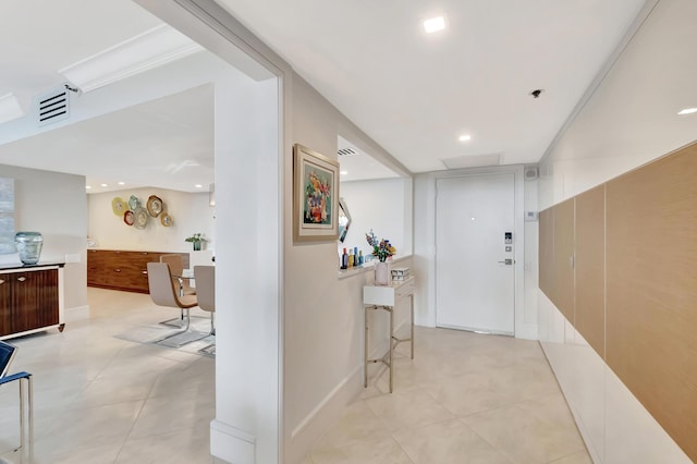 corridor featuring light tile patterned floors, visible vents, recessed lighting, and baseboards