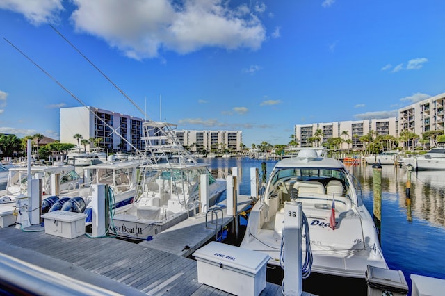 dock area with a view of city and a water view