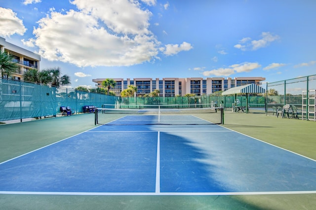 view of tennis court with fence