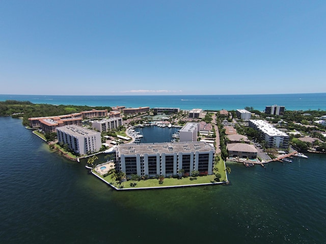 drone / aerial view featuring a water view and a city view