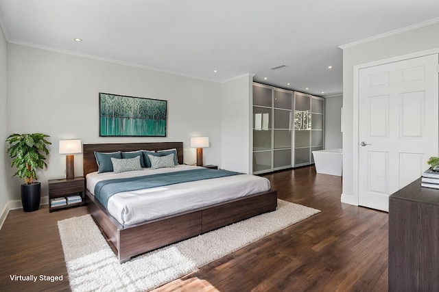 bedroom featuring dark wood-style floors, crown molding, recessed lighting, visible vents, and baseboards