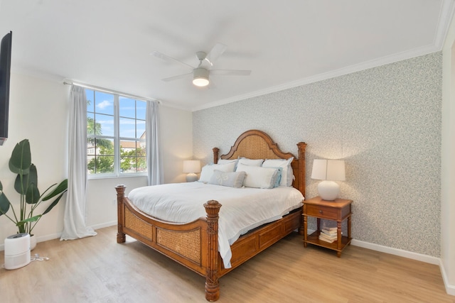 bedroom featuring crown molding, light wood-style floors, baseboards, and wallpapered walls