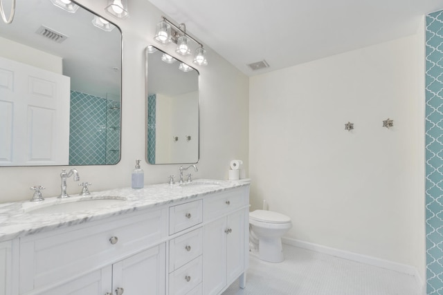 bathroom with visible vents, a sink, and tile patterned floors