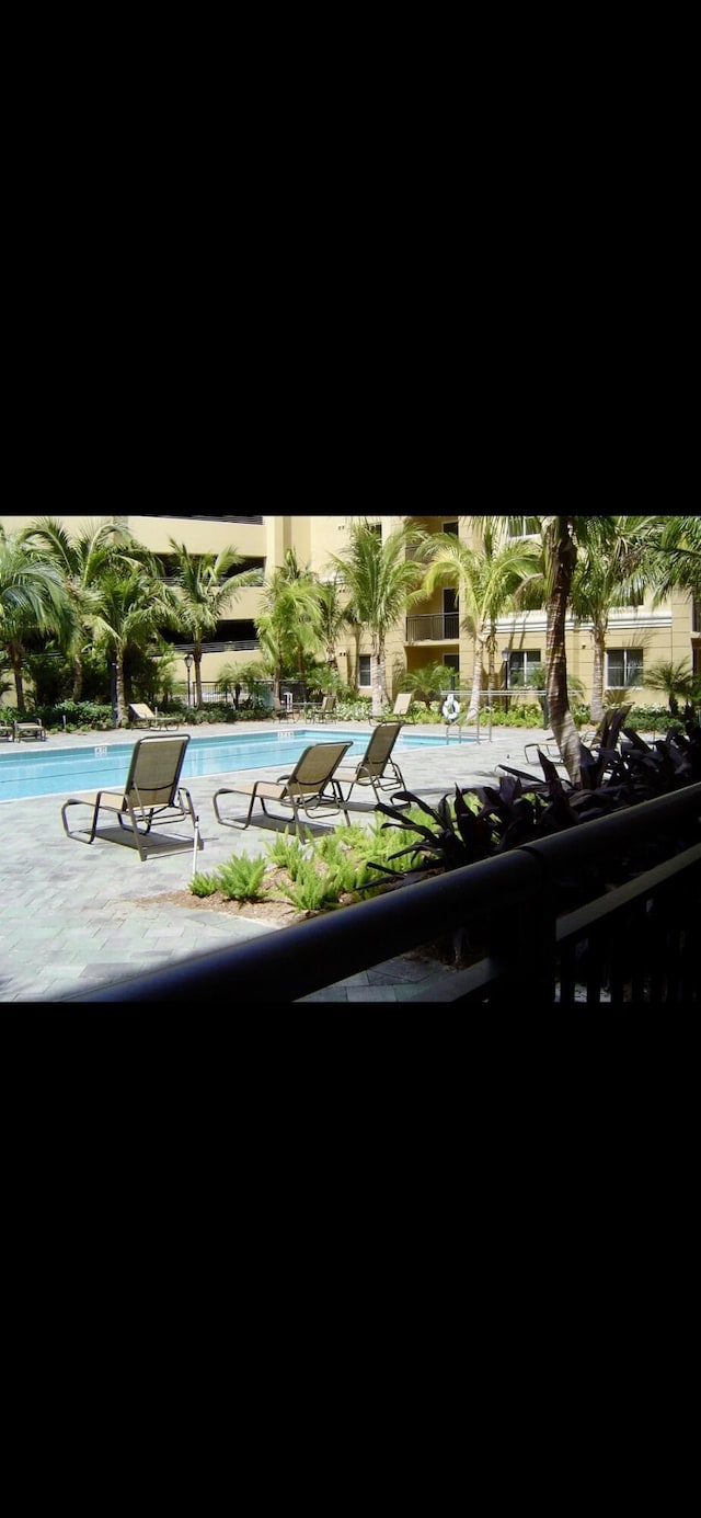 community pool featuring a patio area