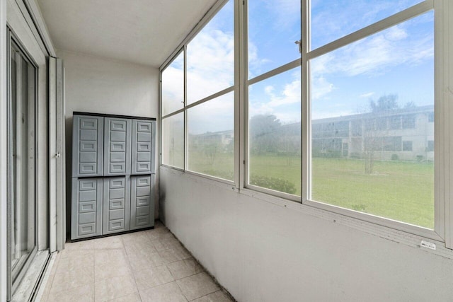 unfurnished sunroom featuring plenty of natural light