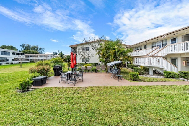 surrounding community featuring a yard and a patio