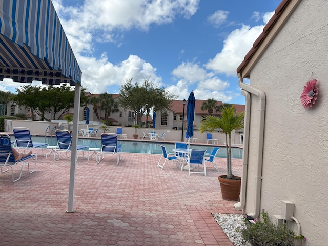 pool with a patio