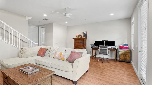 living area with light wood-style floors, recessed lighting, visible vents, and ceiling fan