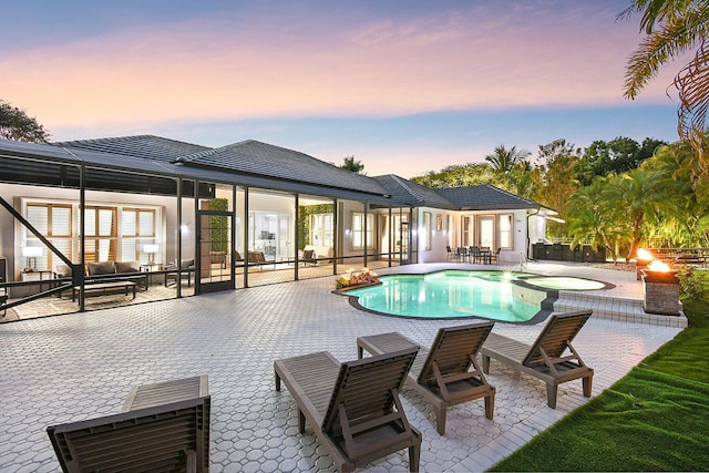 view of pool featuring a patio area and a pool with connected hot tub