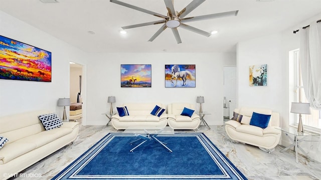 living room with marble finish floor, a ceiling fan, and recessed lighting