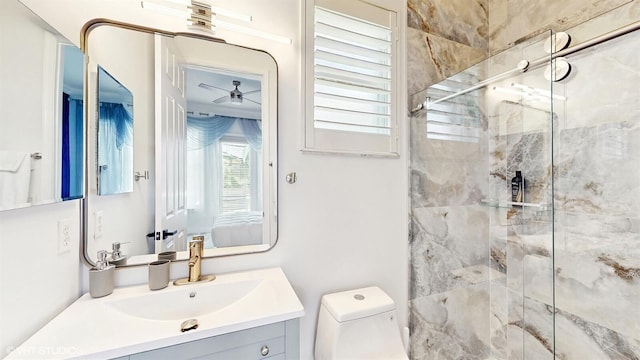 full bathroom featuring toilet, a stall shower, and vanity