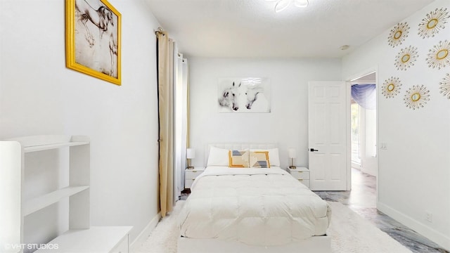 bedroom featuring baseboards