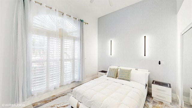 bedroom featuring baseboards and a ceiling fan