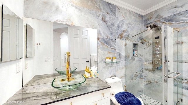 bathroom featuring toilet, vanity, crown molding, and a stall shower