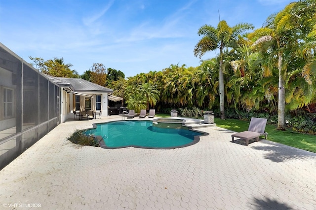 view of pool featuring a patio area and a pool with connected hot tub