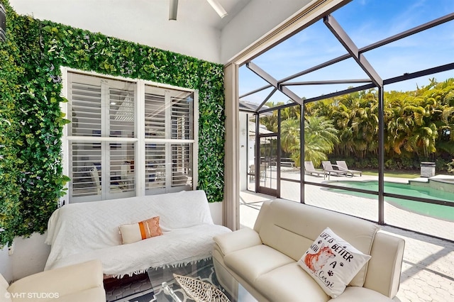 sunroom with outdoor lounge area and a ceiling fan