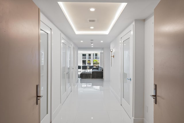 3140 S Ocean Blvd S Unit 502S, Palm Beach, FL 33480 - corridor with tile patterned floors, visible vents, recessed lighting, baseboards, and a raised ceiling