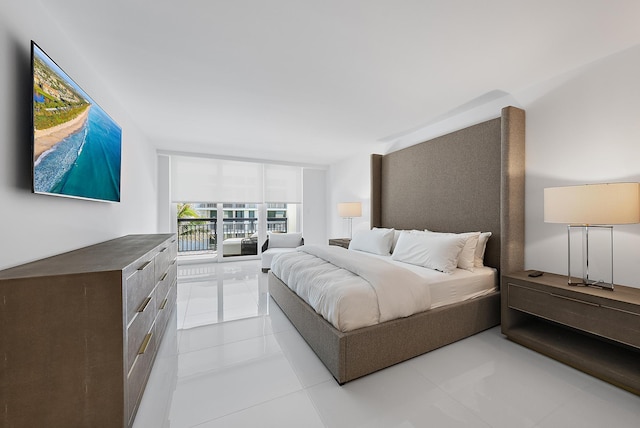 3140 S Ocean Blvd S Unit 502S, Palm Beach, FL 33480 - bedroom with access to outside, light tile patterned flooring, and expansive windows