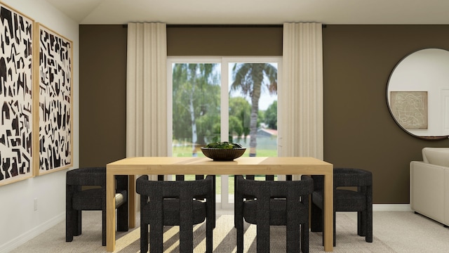 carpeted dining room featuring baseboards