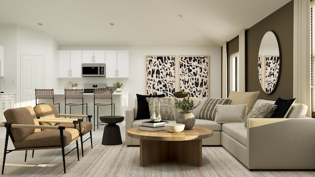 living area featuring vaulted ceiling