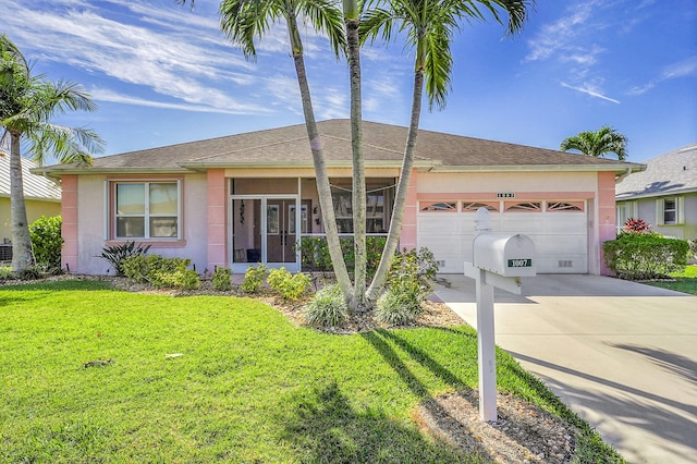 ranch-style home featuring a garage, concrete driveway, a front lawn, and stucco siding