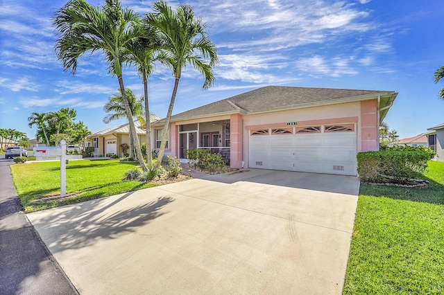 ranch-style house with concrete driveway, a front lawn, an attached garage, and stucco siding