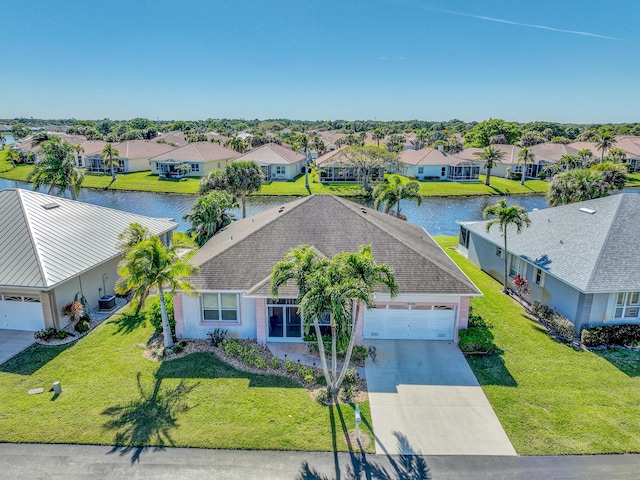 aerial view with a water view and a residential view