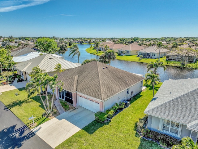 birds eye view of property featuring a residential view and a water view