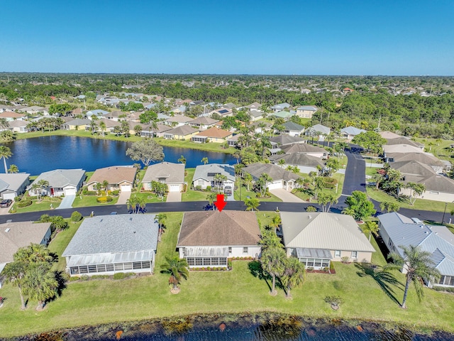 birds eye view of property featuring a residential view and a water view