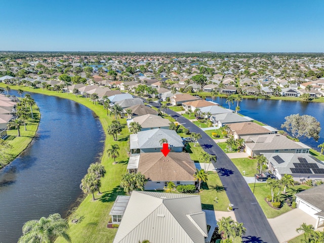 aerial view featuring a water view and a residential view