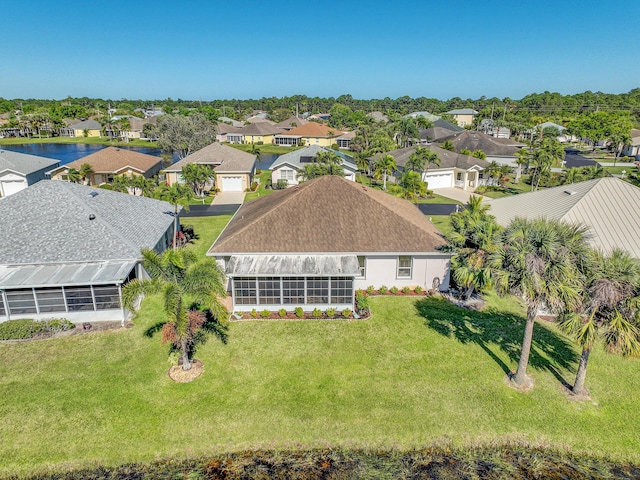 birds eye view of property with a residential view