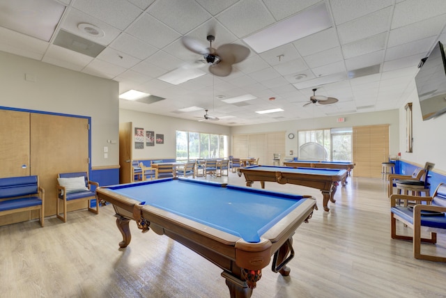 recreation room with light wood-style floors, a paneled ceiling, pool table, and a ceiling fan