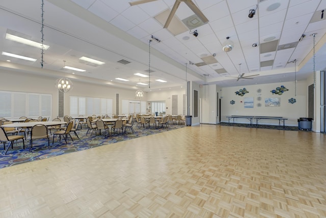 misc room with baseboards, visible vents, and a drop ceiling