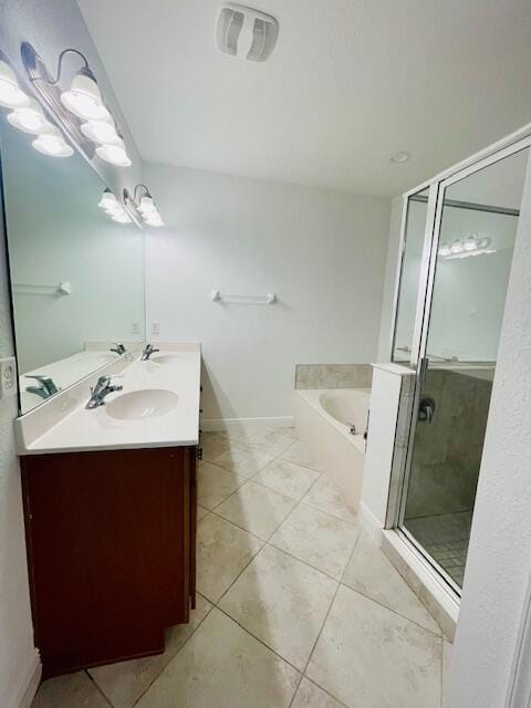 full bath featuring double vanity, visible vents, a garden tub, tile patterned flooring, and a sink